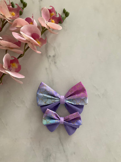 Mermaid petal hair bow in iridescent purple and blue mermaid scale print with purple accent fabric — handmade by The Hairloom Co. Canberra Australia